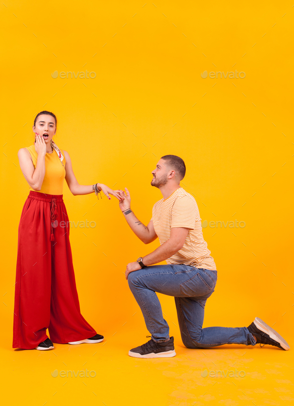 Boyfriend down on his knees asking girlfriend to marry him