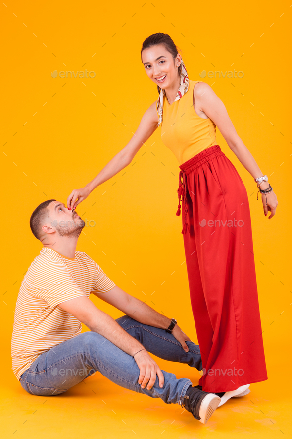 Beautiful girlfriend poking her attractive boyfriend nose Stock Photo