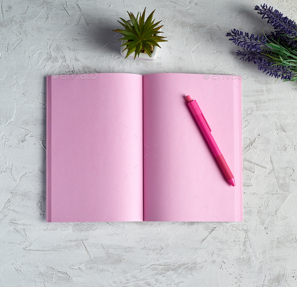 Open notebook with blank pink pages, red pencil and a bouquet of lavenders
