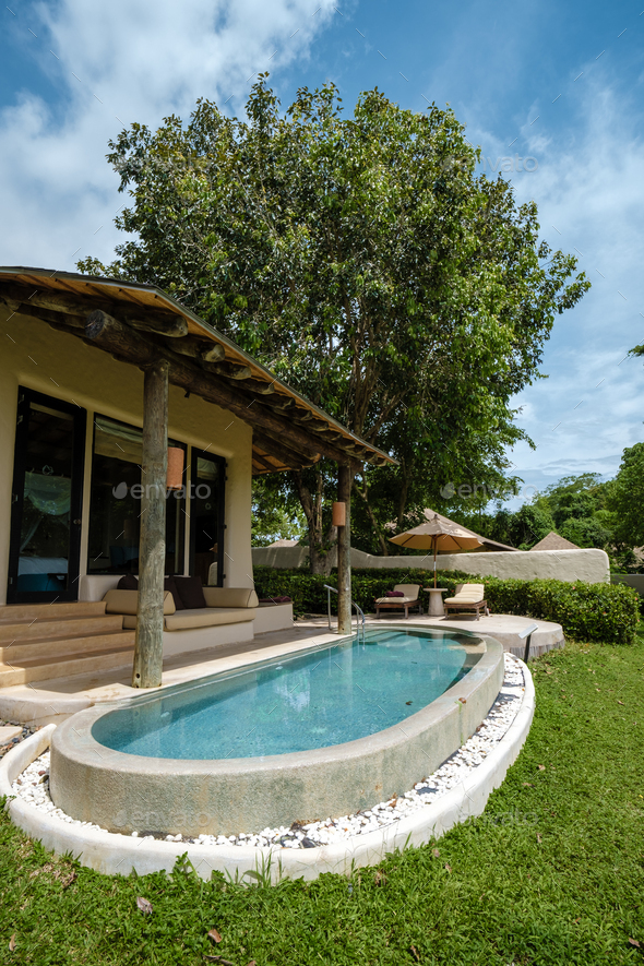 View of infinity pool in looking out over the ocean, luxury vacation private ...