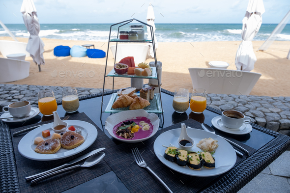 Breakfast on the beach in Phuket Thailand, Luxury table with Japanes style omelet and pancakes