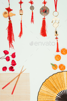 top view of frame made of various chinese talismans and objects isolated on white, Chinese New Year
