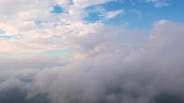 Aerial view running clouds in the sky in motion. Time lapse white clouds