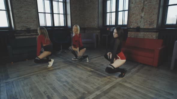 Three Beautiful Girls Are Dancing Twerk in a Hall. Booty Shake.