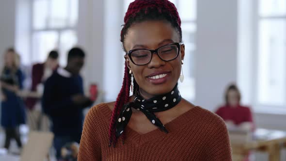 Young Happy African Creative Designer, Professional Successful Business Woman in Eyeglasses alt