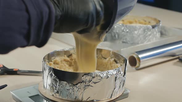 the Pastry Chef Spreads the Custard From the Pan Into the Cake Using a Silicone Spatula