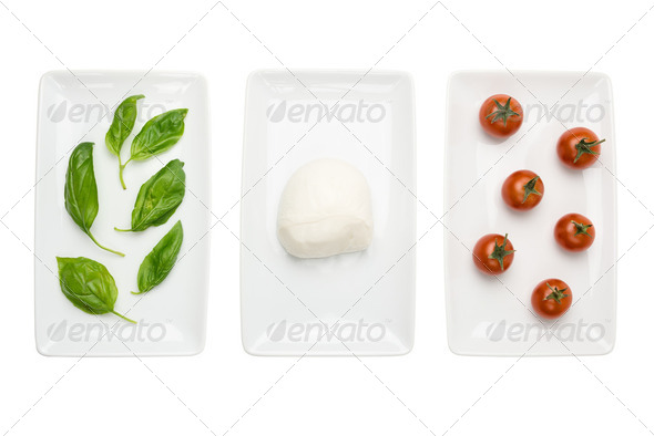 Italian food like flag, basil mozzarella tomato on white