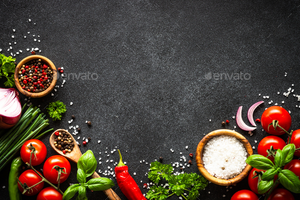 Food cooking background on black stone table. Stock Photo by Nadianb