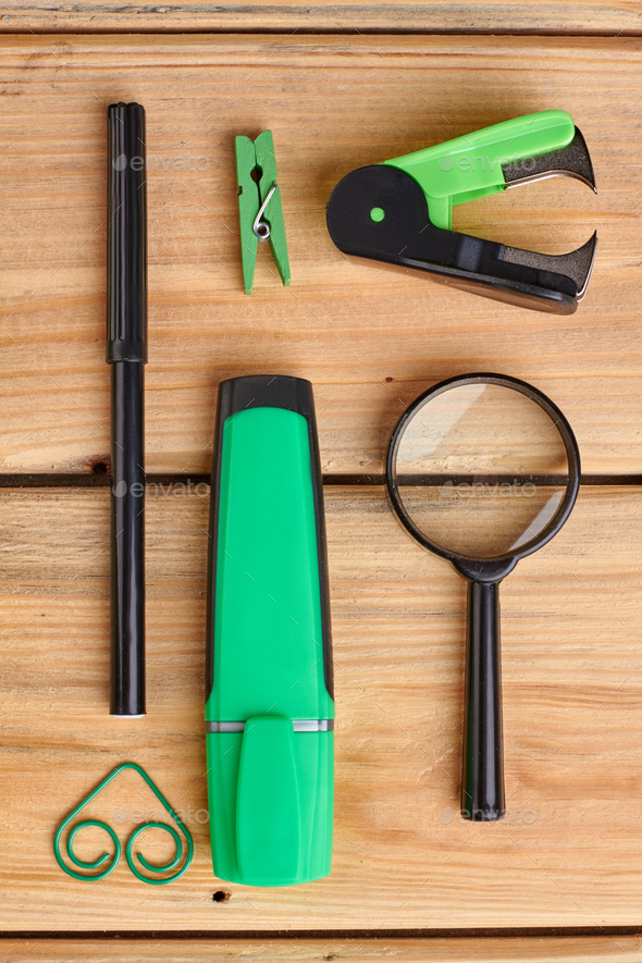 Stationery objects on wooden background.