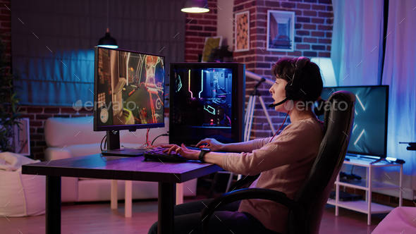 Man disappointed while playing video game with girlfriend at home stock  photo