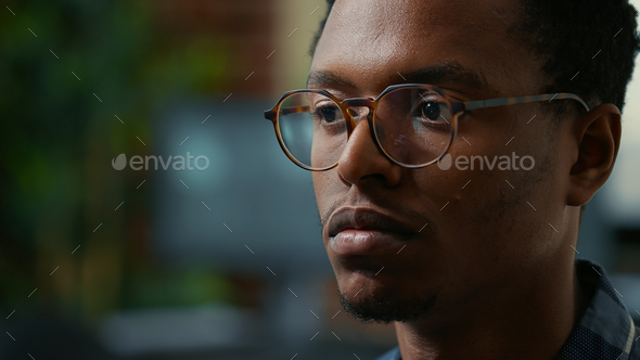 Portrait of software developer with glasses reading ai algorithm working focused