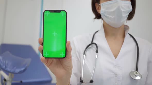 Gynecologist Shows an Smartphone with a Chromakey