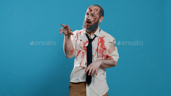 Goofy ugly zombie dancing childish on blue background.