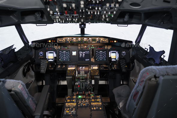 Empty airplane cockpit with electronic flying navigation panel