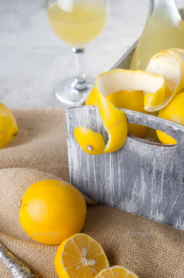 Traditional Italian liqueur Limoncello liqueur and fresh citrus fruits