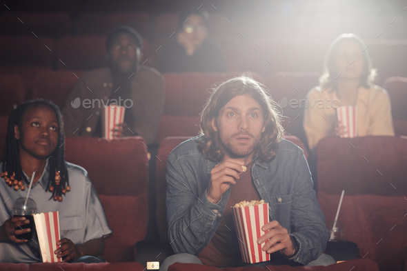 Group of friends sitting in cinema