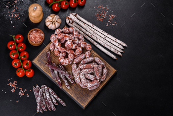 Dry cured sausage on a dark background