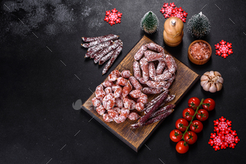 Dry cured sausage on a dark background