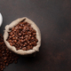 Takeaway cup, roasted coffee beans and ground coffee in holder - PhotoDune Item for Sale