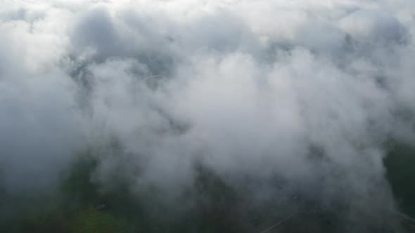 Aerial View of Thick Gray Clouds Shot From Above alt