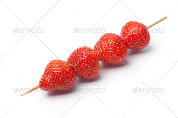 strawberries on a wooden stick - Stock Photo - Images