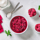 Raspberry jam in a bowl, fresh berries and mint leaves on a light background. - PhotoDune Item for Sale