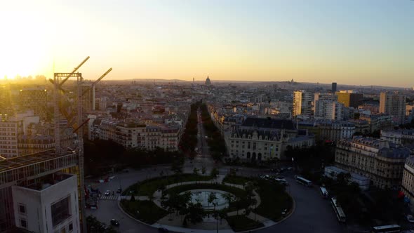 Aerial view of Paris France skyline rooftops sunset.  alt