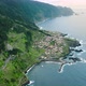 High elevation aerial view over scenic Seixal village on Madeira coastline - VideoHive Item for Sale