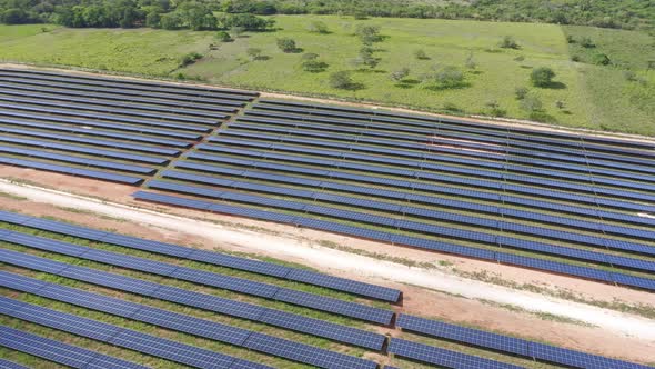 Drone Shot Panning Over Rows of Solar Panels Harnessing Sun Power for Renewable Energy at El Soco Ph alt