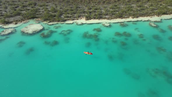 People Riding Kayak in Los Rapidos Lagoon in Bacalar Mexico alt