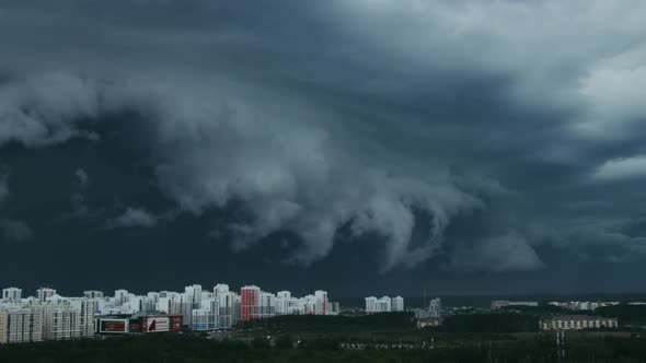 Huge black rainy cloud over a city