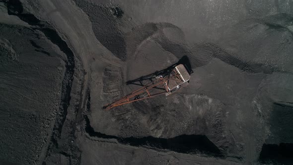Top View Camera Fly Over Working Walking Excavator in Quarry of Kusbass Coal Deposit