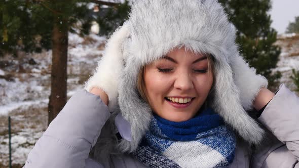 Woman in Winter Clothing Fur Hat