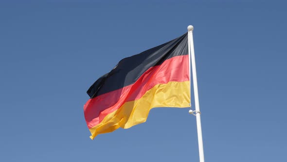 Famous Germany national symbol waving in front of blue sky 4K 2160p 30fps UHD footage - Recognizable alt