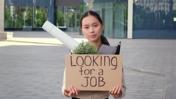 Unemployed Japanese Business Lady Looking For A Job Standing Outdoors alt