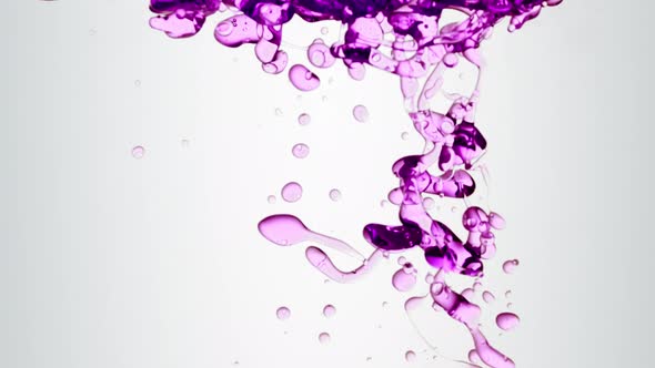 Transparent Cosmetic Purple Oil Bubbles and Shapes on White Background