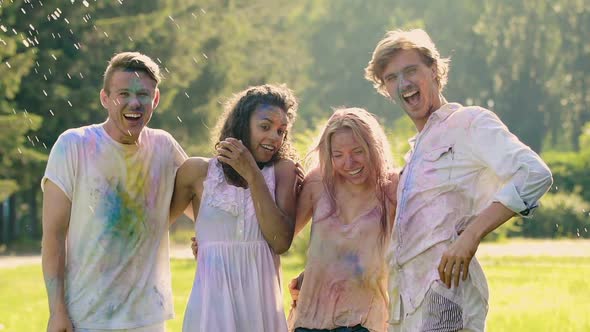 Amused Couples Celebrating Summer Open-Air Color Festival, Extra-Slow Motion alt