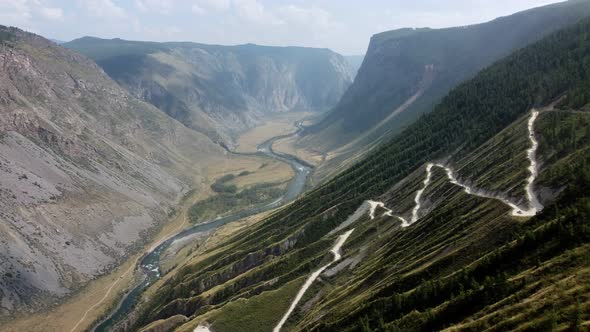 a larger canyon with a winding road