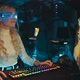 Blonde Streamer Playing Shooter in Neon 3D Glasses