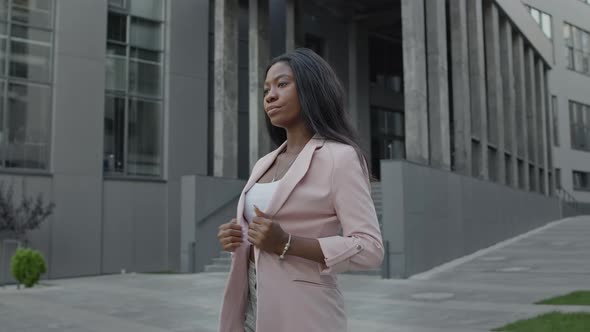 Beautiful Young Black Girl Stands On The Street alt