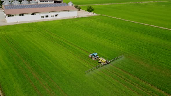 Tractor Sprayer Fertilizer, Herbicide, Pesticide on Agriculture Farm Field alt