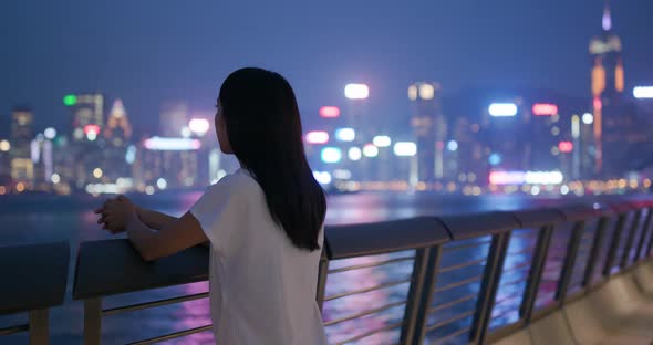 Woman look at the city view in evening