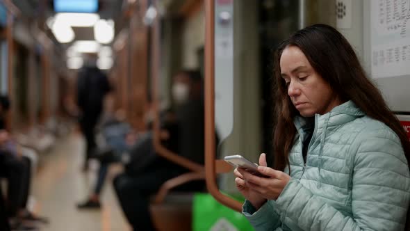 Portrait of a Brunette with Long Hair on the Train alt