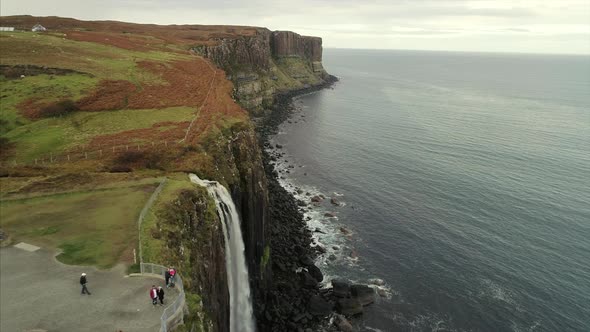 Aerial of the Waterfall Over Oisgill Bay Near Neist Point Scotland alt