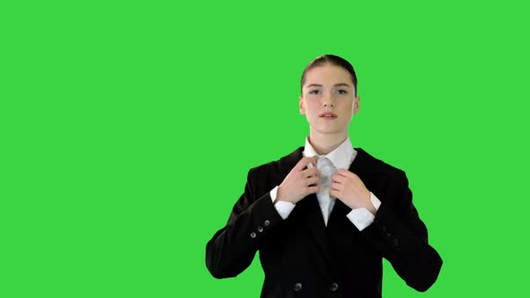 Young Woman Adjusting Her Office Suit Crossing Arms Putting Hand on Hip on a Green Screen Chroma Key