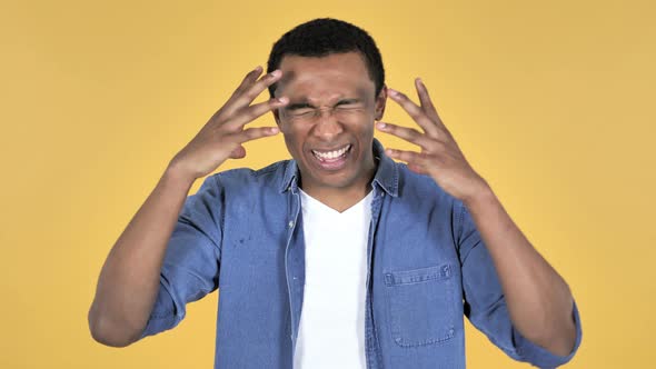 Screaming Angry Young African Man, Yellow Background alt