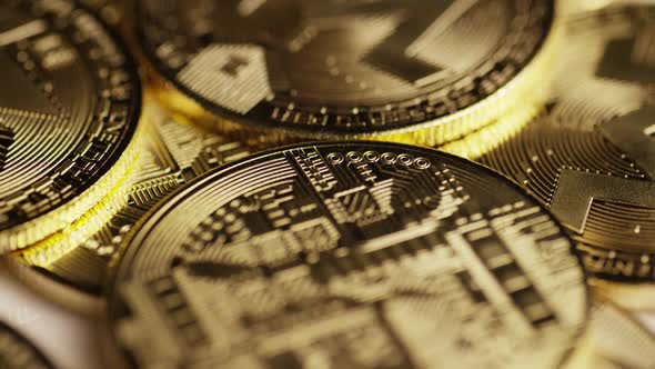 Rotating shot of Bitcoins (digital cryptocurrency) - BITCOIN MONERO  alt