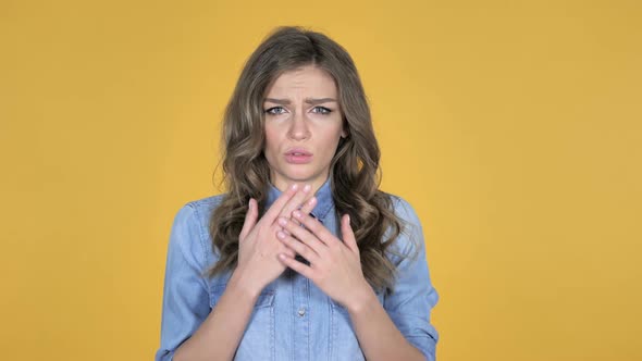 Surprised Young Girl in Shock Isolated on Yellow Background Wondering alt