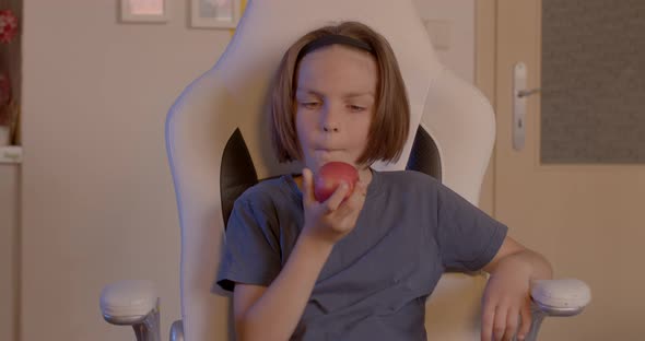 Child Eats an Apple alt