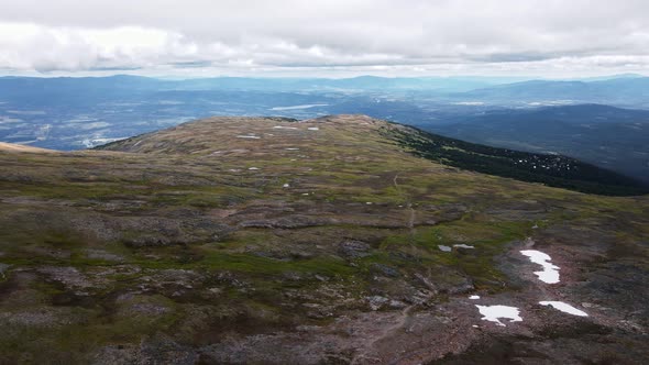 Stunning, open landscapes surrounding Crater Lake in British Columbia, Canada. Sweeping aerial shot alt